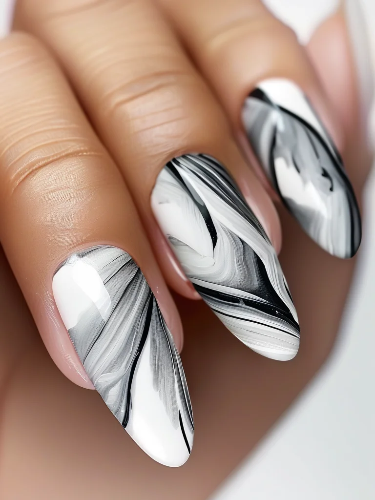 White and grey marble pattern on glossy coffin nails.