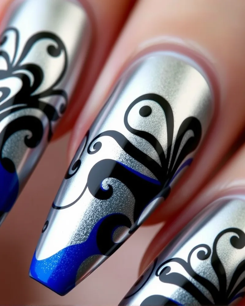 7 Viral Pucci Nails Trends You Need To Try This Season 5 Coffin-shaped nails with a metallic silver chrome finish, overlaid with black and blue swirling Pucci patterns.