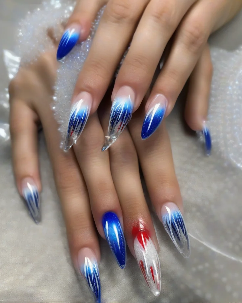 Clear almond-shaped nails with French tips painted as vibrant red, white, and blue firework bursts against the bare nail.