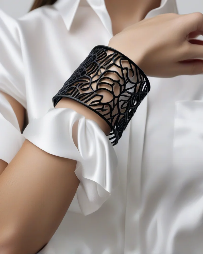 Close-up of a model wearing a versatile modular 3D-printed cuff bracelet with a silk blouse.