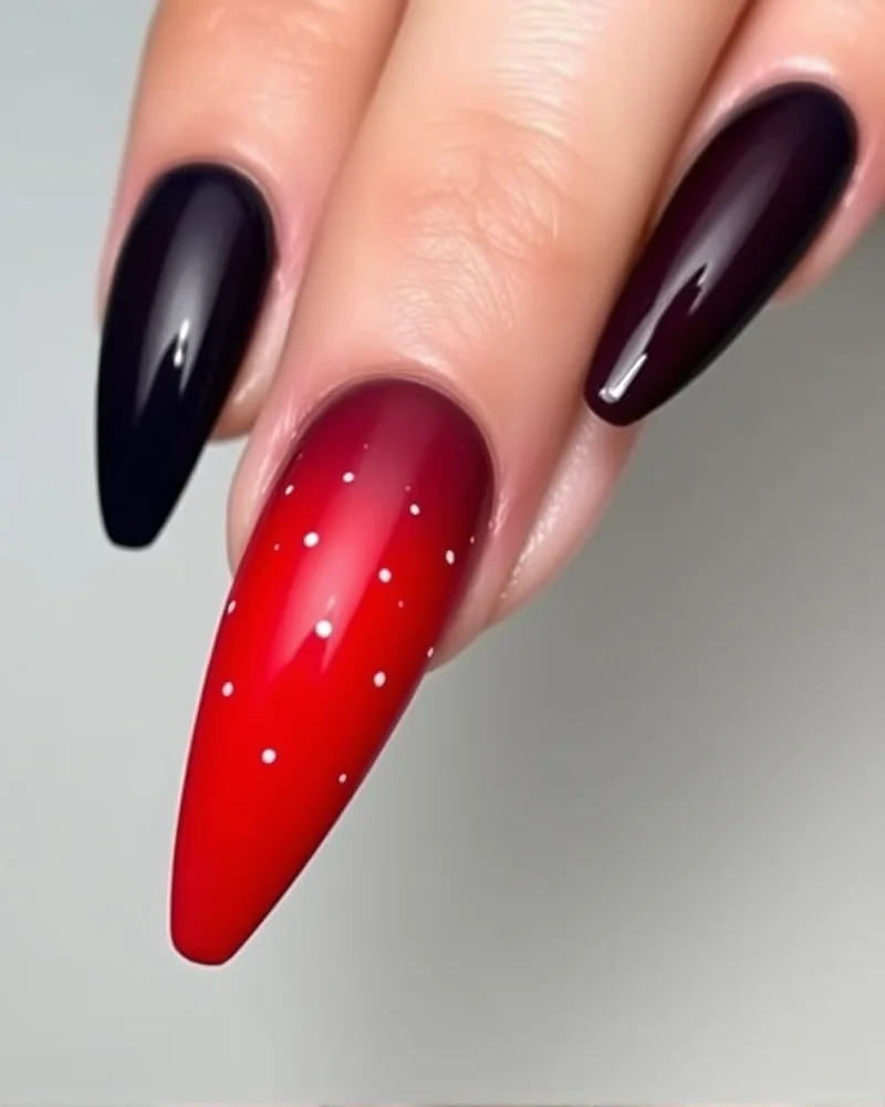 Stiletto nails showcasing a seamless blue-to-red gradient with delicate white dot details reminiscent of fireworks.