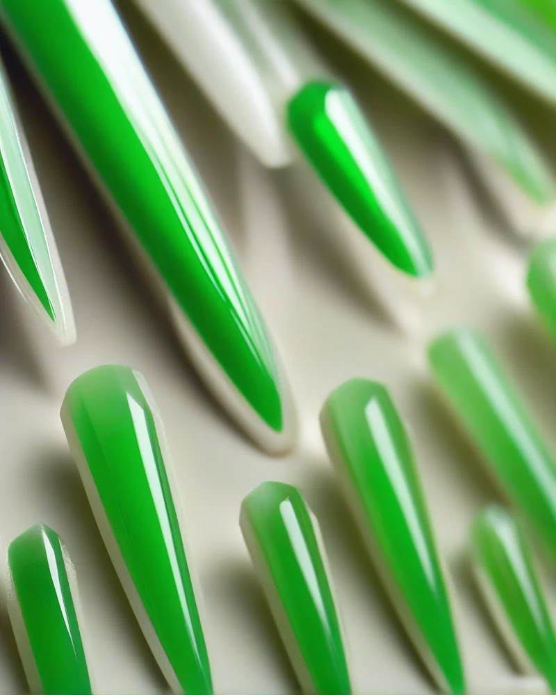 Peridot Nails: The Vibrant Green Trend Defining Luxury Manicures 6 Classic French manicure with modern peridot green tips.