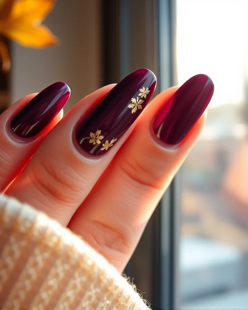 Close-up of almond shaped nails with velvet finish and 3D embossed nail art designs for fall.